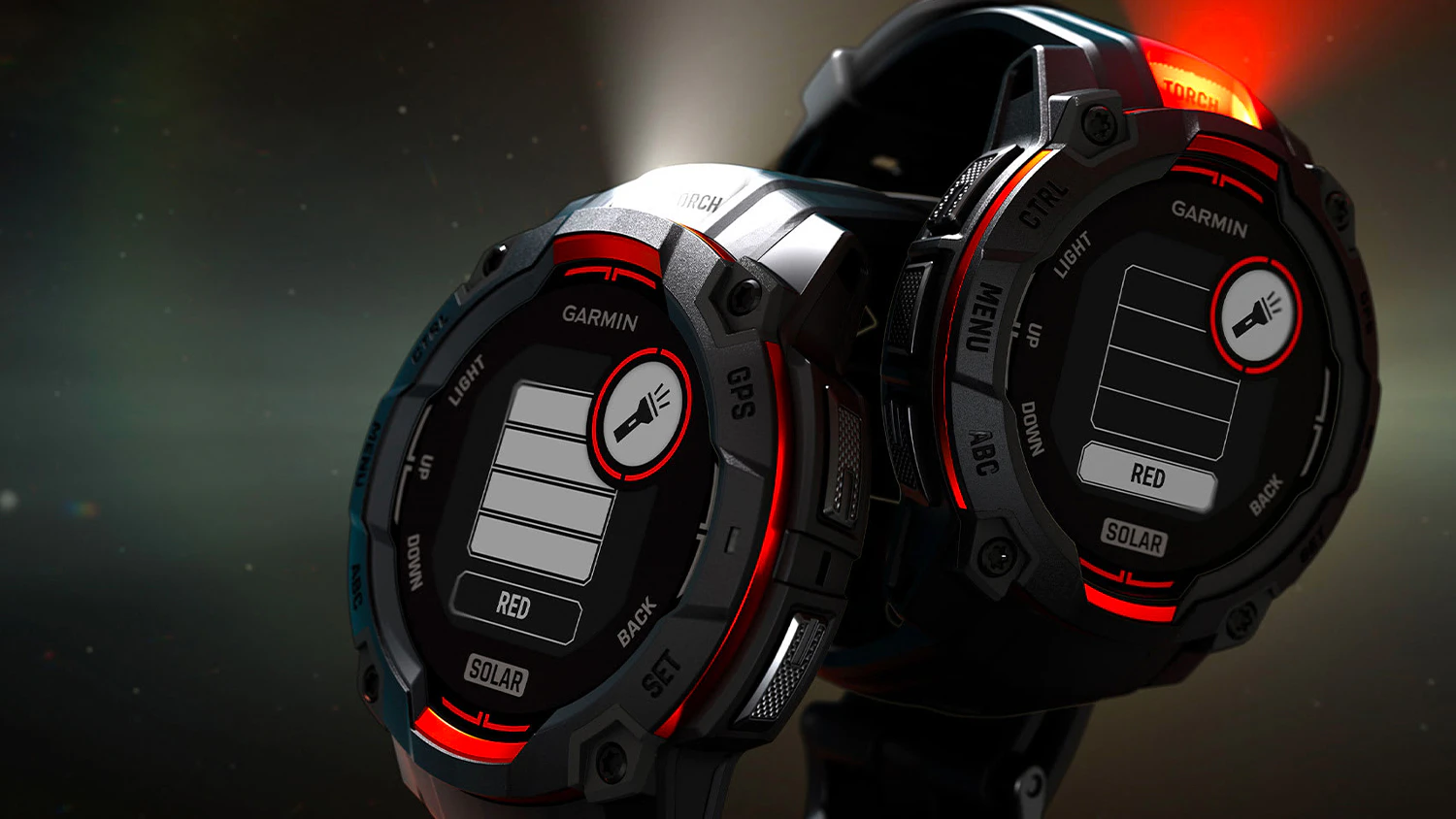 Dvoje smart hodinky Garmin Instinct 3 s rozsvícenými svítilnami