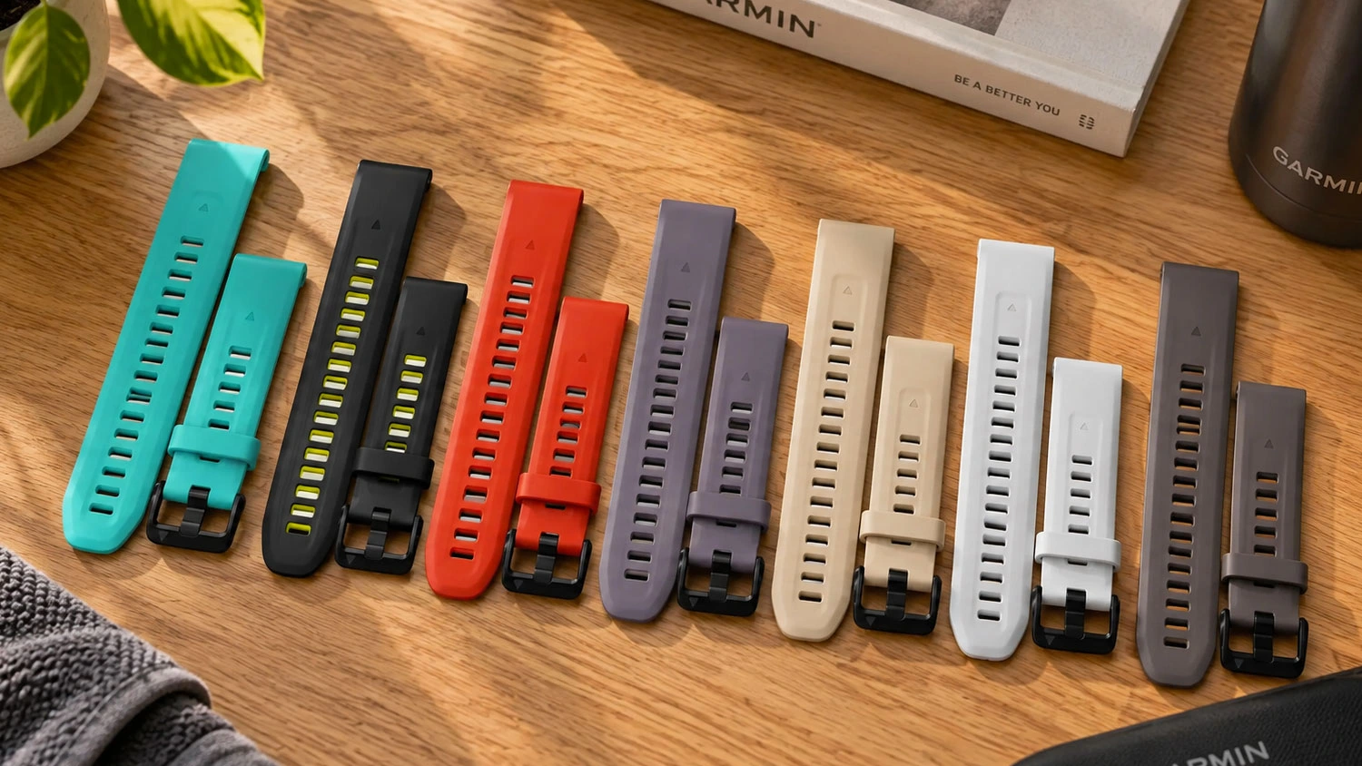 Barevné variace řemínků Garmin QuickFit 20 mm silikon položených na stole