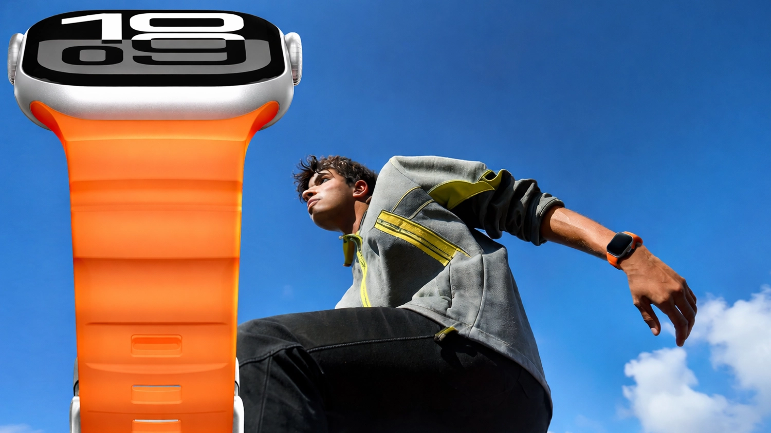 Hodinky Apple Watch s oranžovým řemínkem na ruce