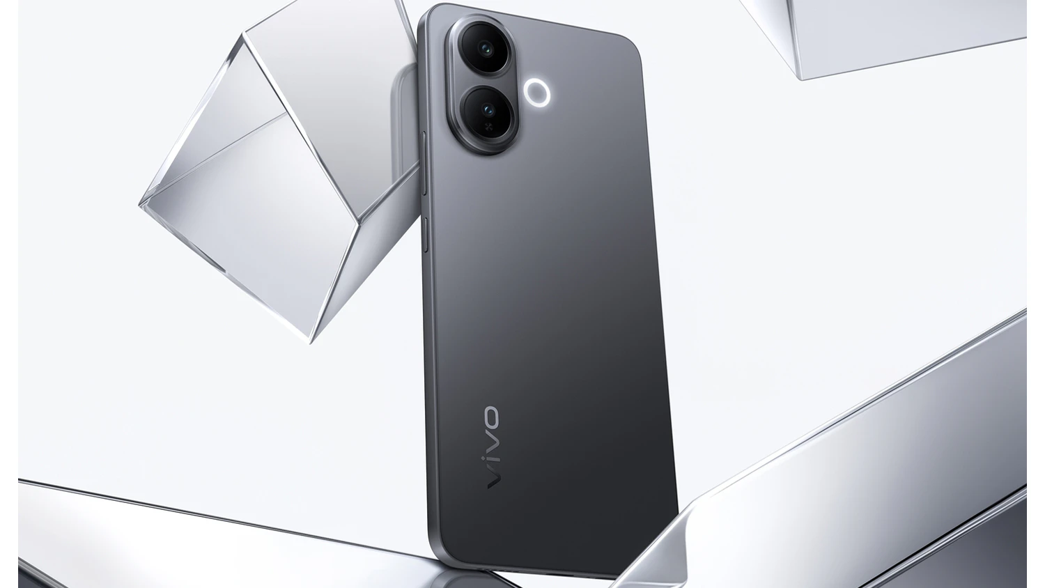 Mobilní telefon Vivo V70 Lite na šedém pozadí