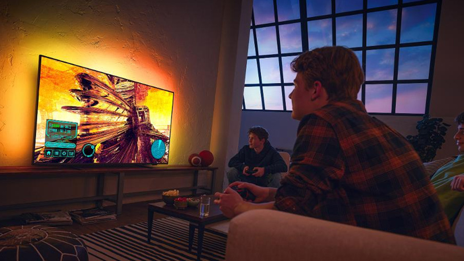 Tři mlad&iacute;ci hraj&iacute; hry na televizoru PHILIPS