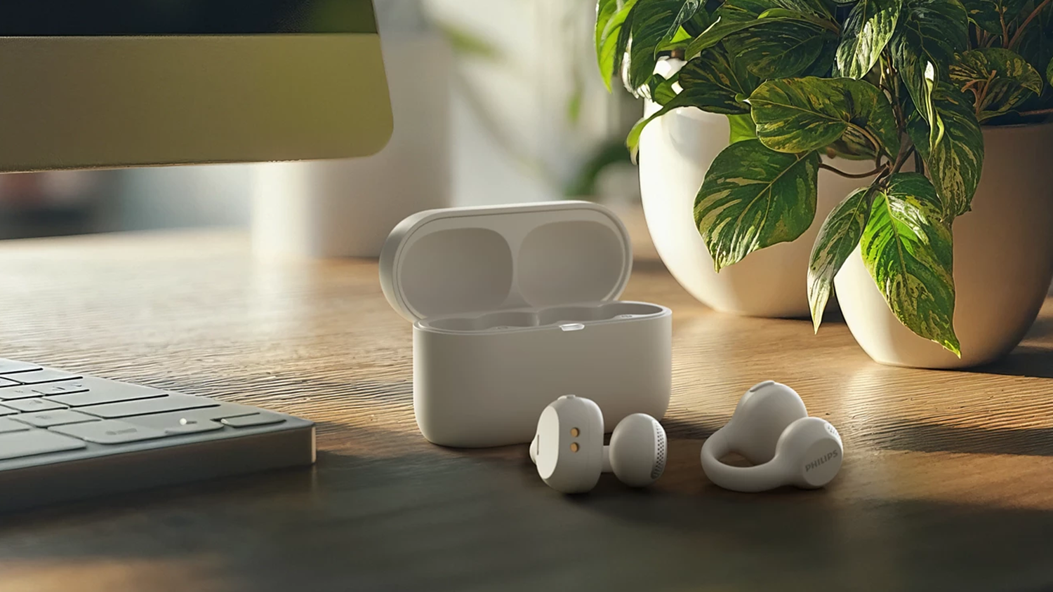 Bezdrôtové slúchadlá Philips TAQ2000WT na stole