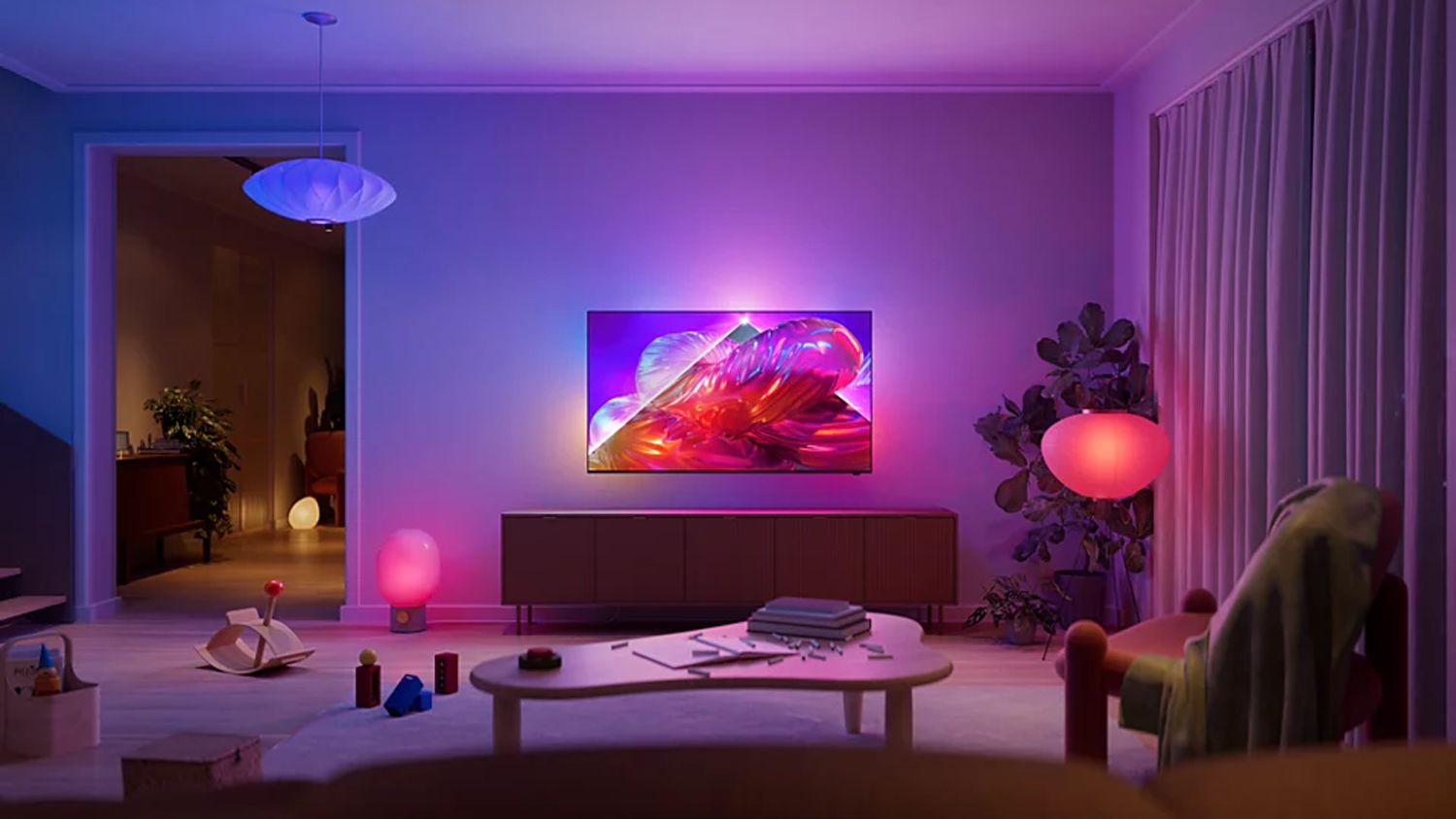 4K QLED televize Philips 50PQS9011 na stěně v ob&yacute;v&aacute;ku