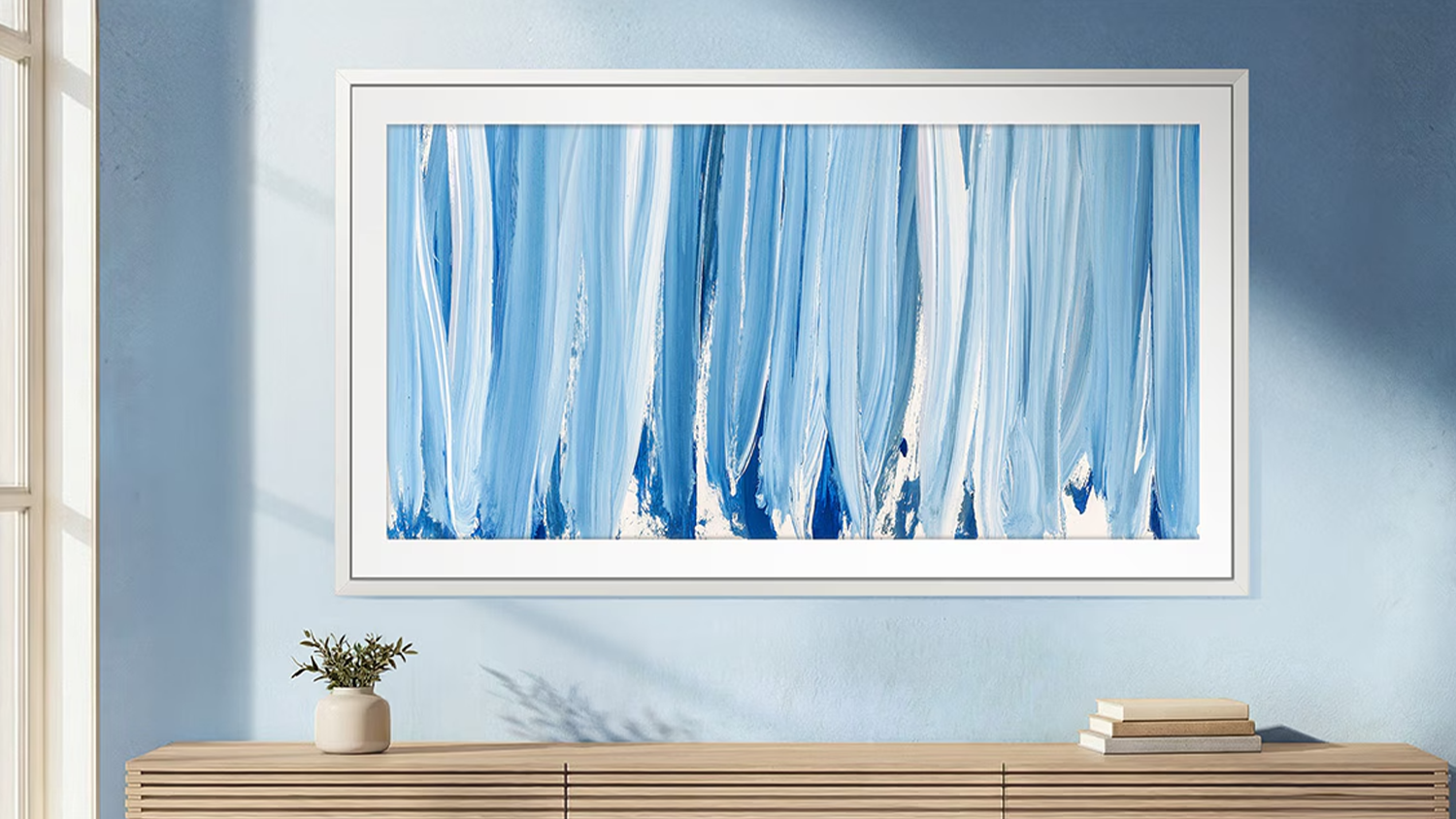 Neo QLED televízia Samsung The Frame Pro QE55LS03HW ako umelecké dielo na modrej stene