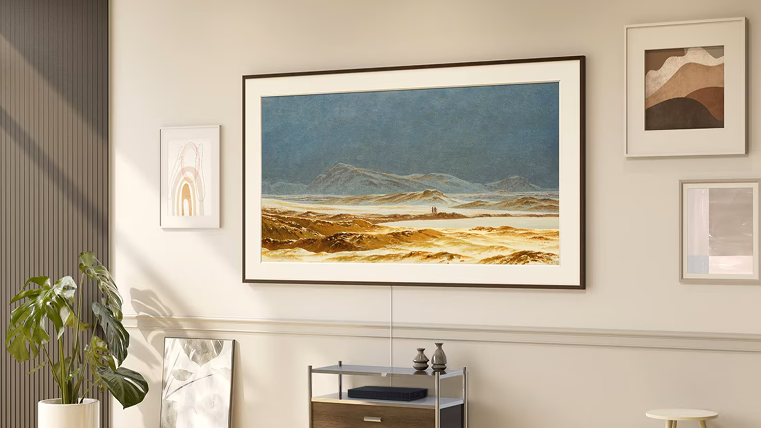 Neo QLED televize Samsung The Frame QE55LS03HA zobrazující umělecké dílo na stěně s obrazy