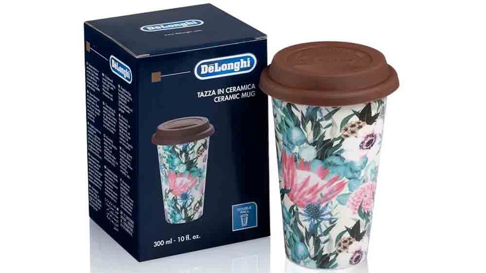 Termo hrnek De'Longhi DLSC065 stojící vedle originálního obalu