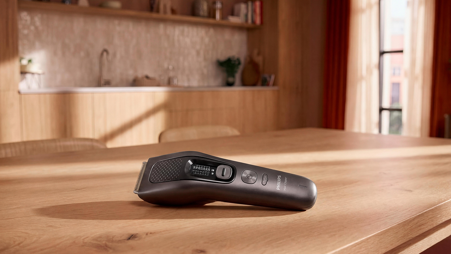 Zastrihávač vlasov Philips Series 9000 9721/15 položený na stole