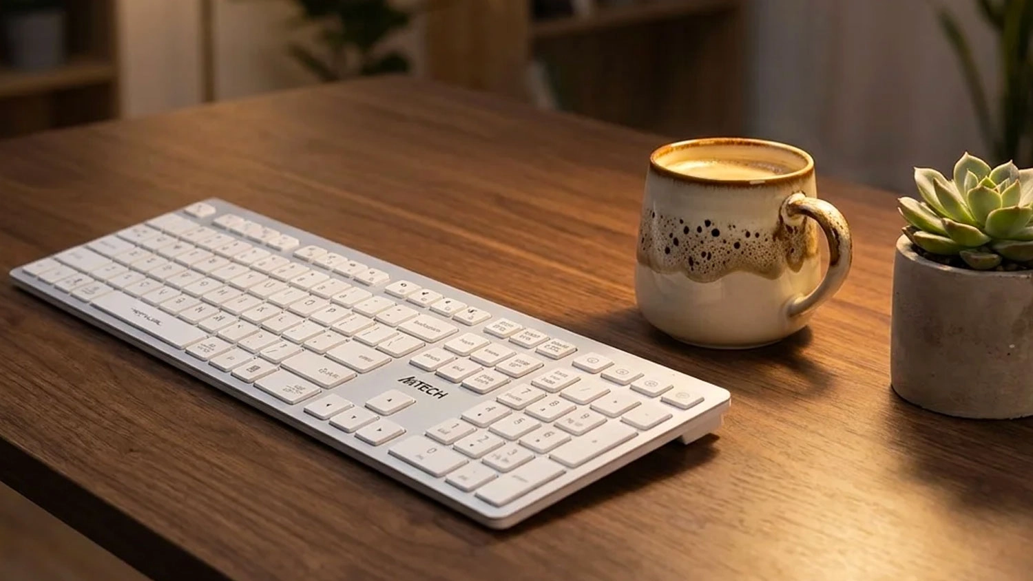 Bezdrôtová klávesnica A4TECH FSTYLER FBX50C na pracovnom stole pred notebookom