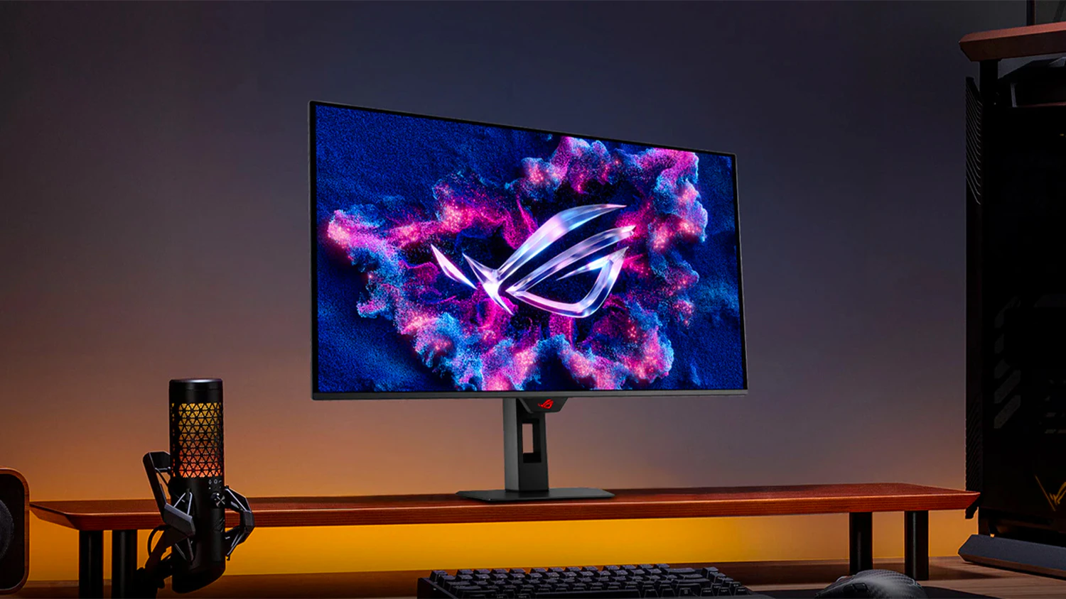 Hern&yacute; monitor ASUS ROG Strix OLED XG32UCDS na stole