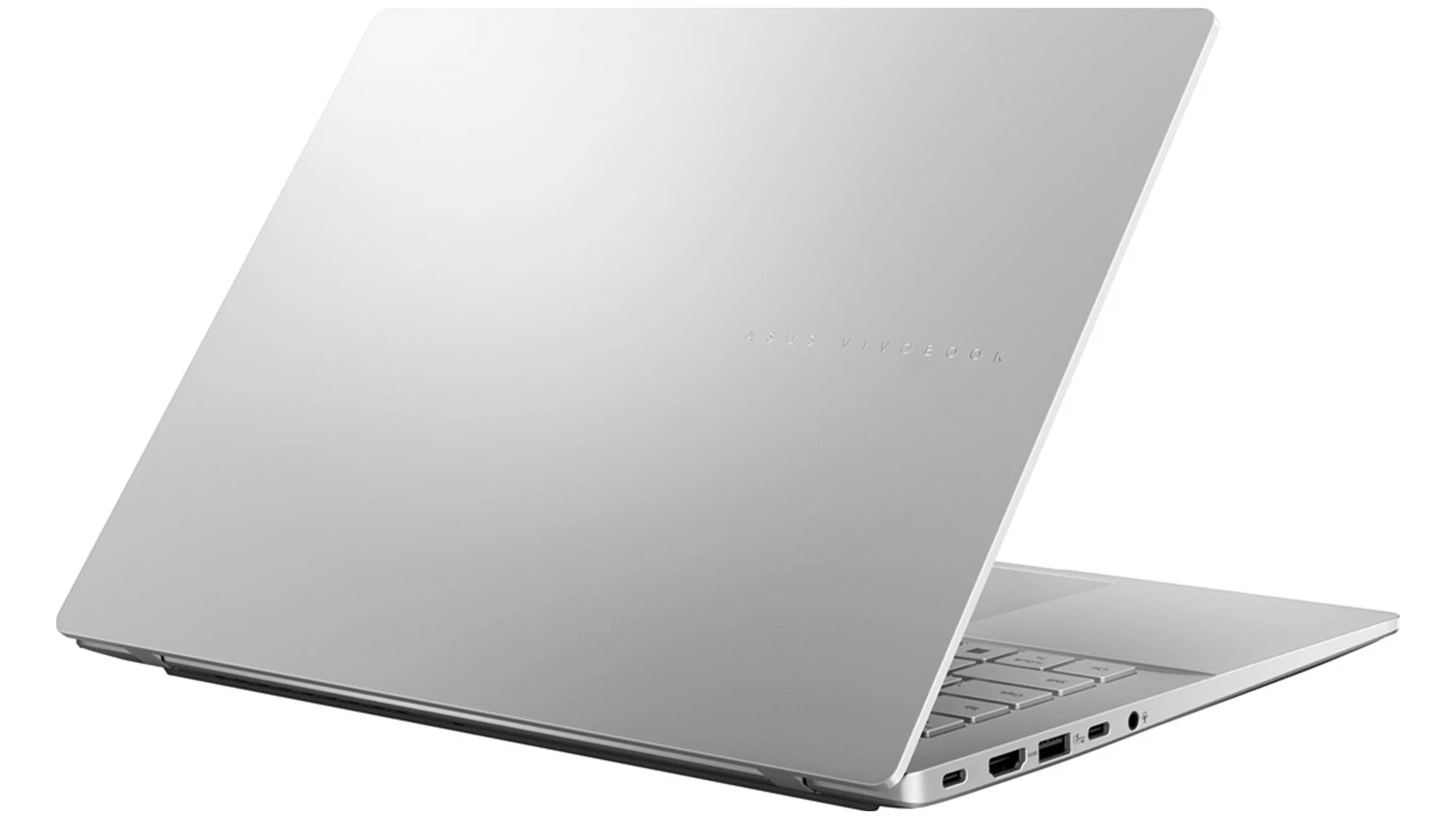 Pohled šikmo zezadu na přivřený notebook Asus Vivobook S14