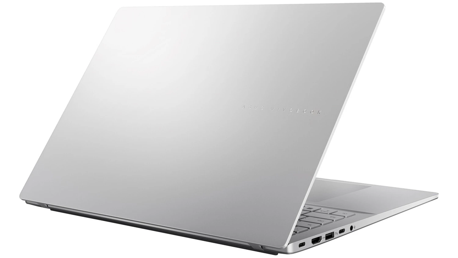 pohled šikmo zezadu na přivřený notebook Asus Vivobook S16