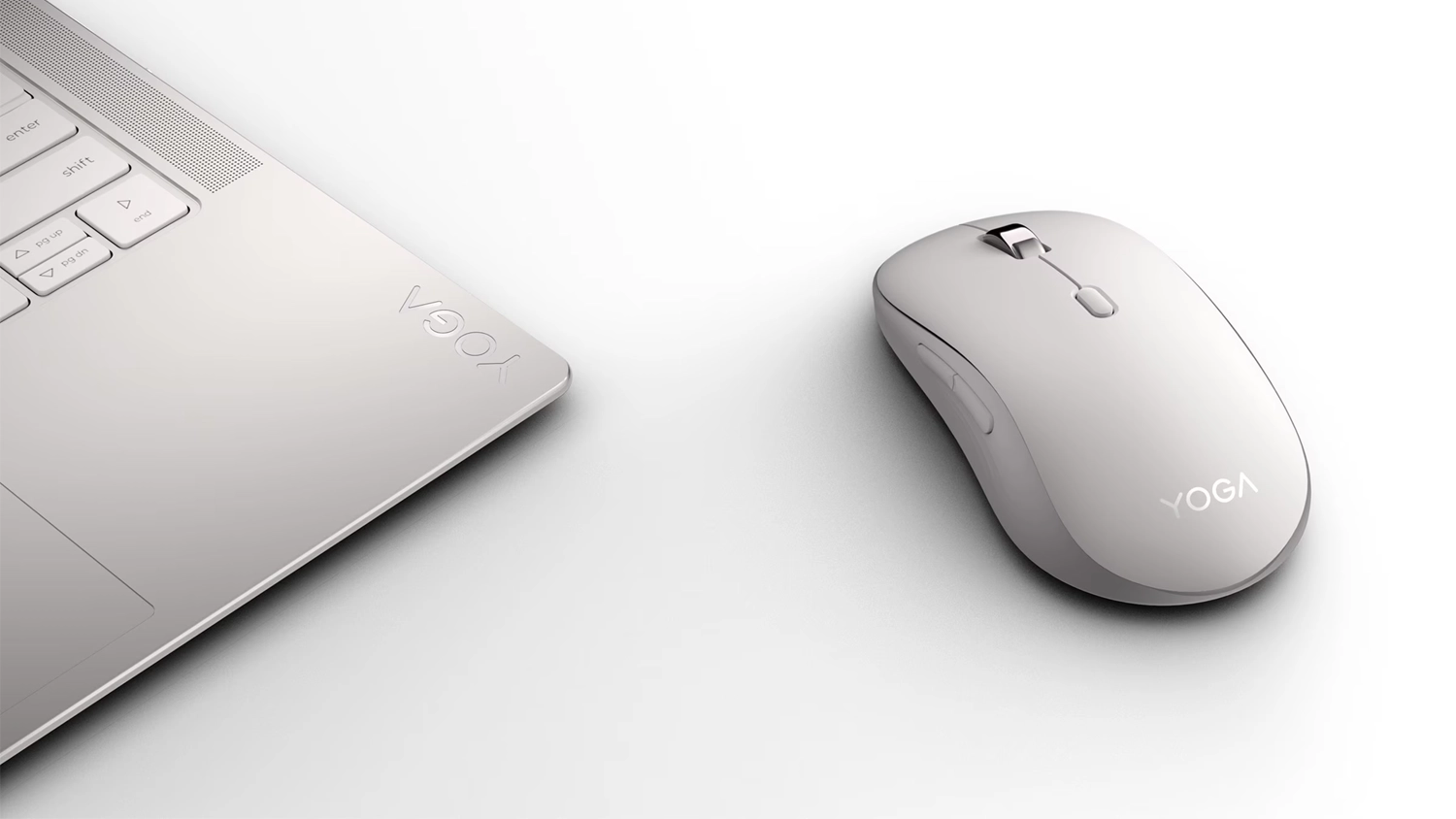 Myš Lenovo Yoga Bluetooth Silent biela vedľa notebooku