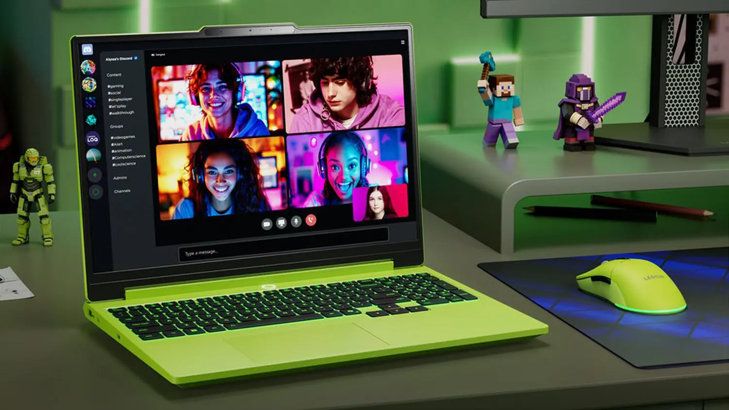 Stůl s notebookem Lenovo a hern&iacute;mi postavičkami