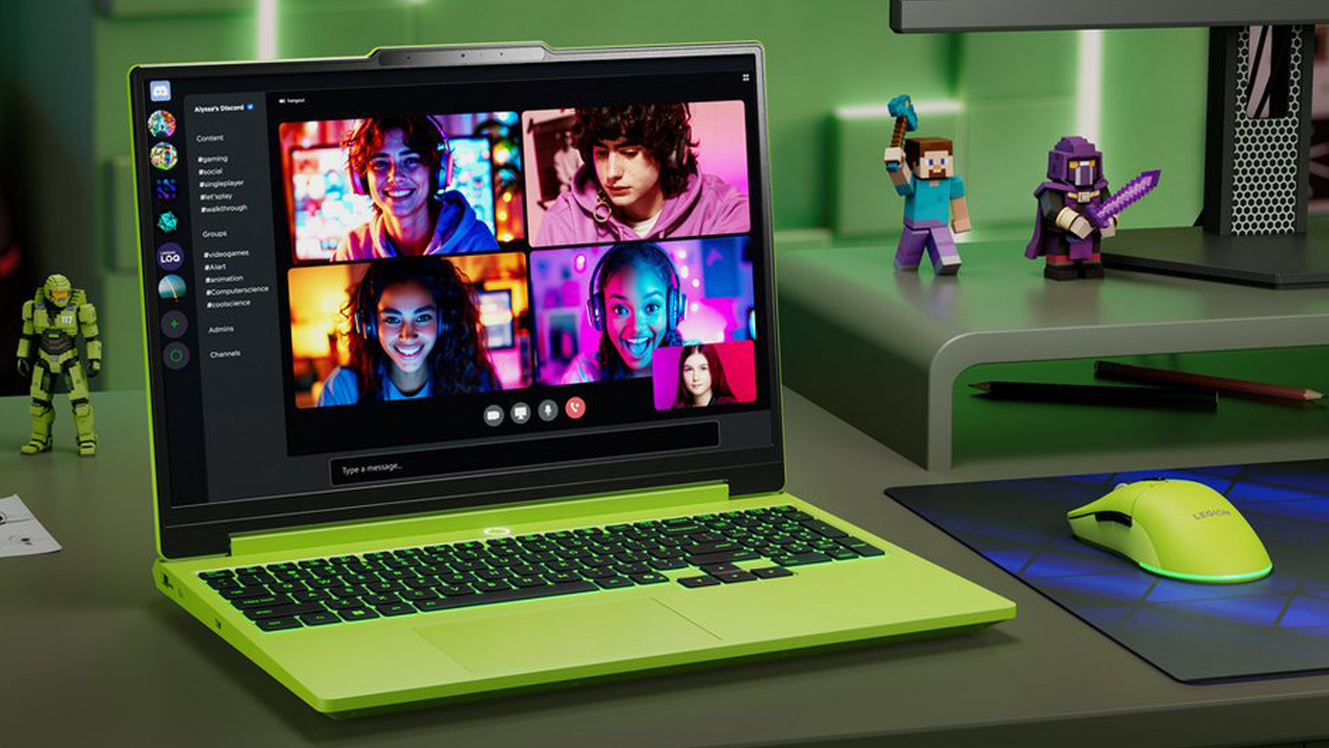 Stůl s notebookem Lenovo a hern&iacute;mi postavičkami