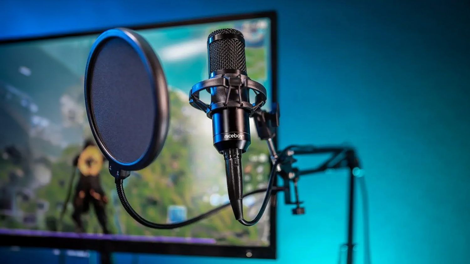 Mikrofon Niceboy VOICE Handle Black před monitorem