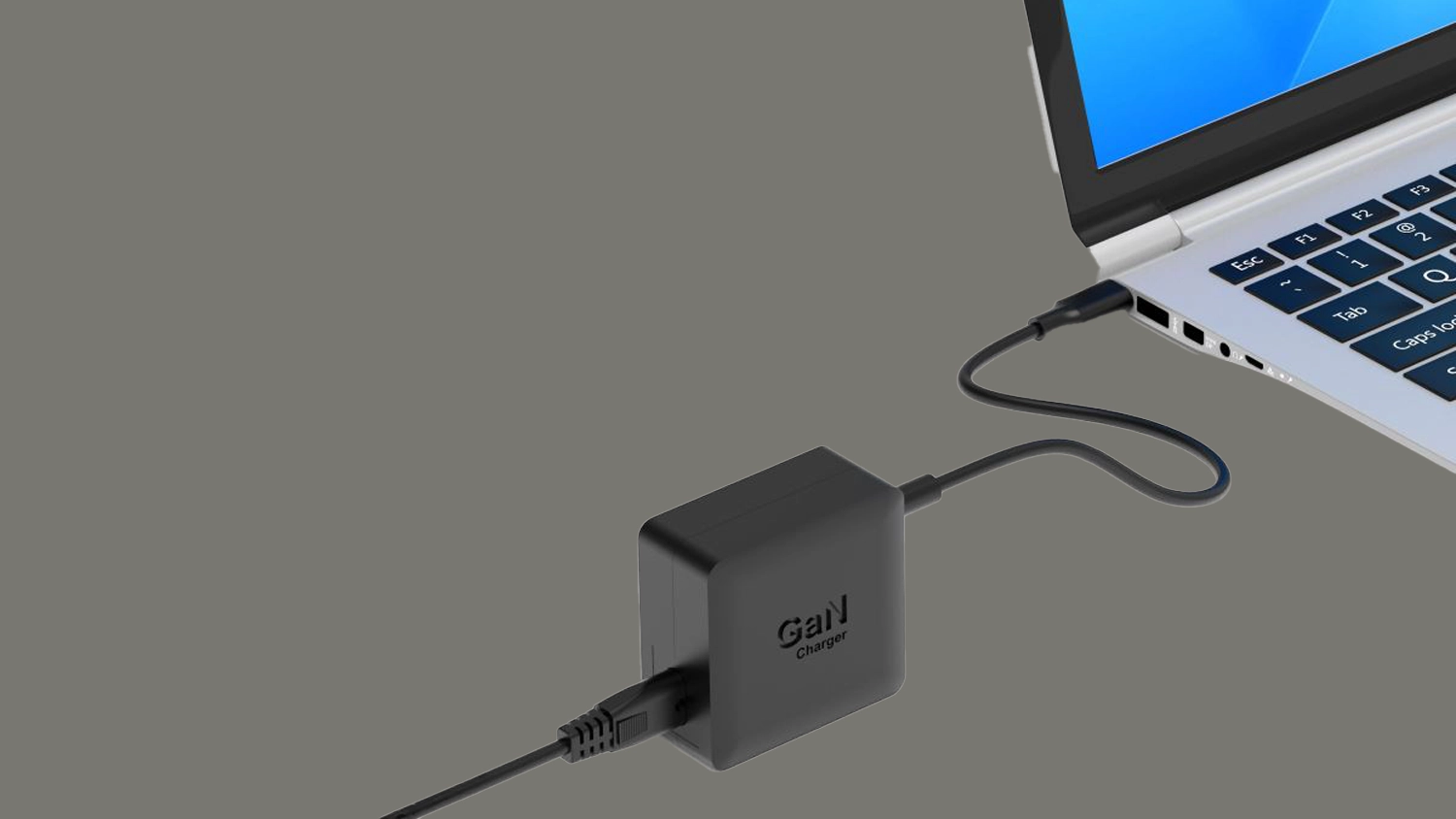 Nap&aacute;jec&iacute; adapt&eacute;r PORT Connect USB-C 65 W čern&yacute; zapojen&yacute; do notebooku