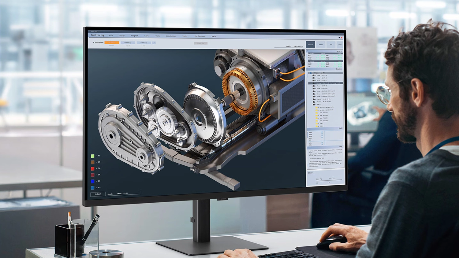 Muž pracuj&uacute;ci na monitore Samsung