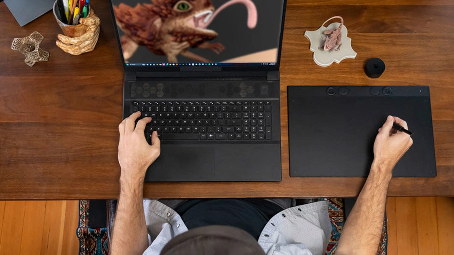 Muž kresl&iacute;c&iacute; na tabletu Wacom Intuos Pro M