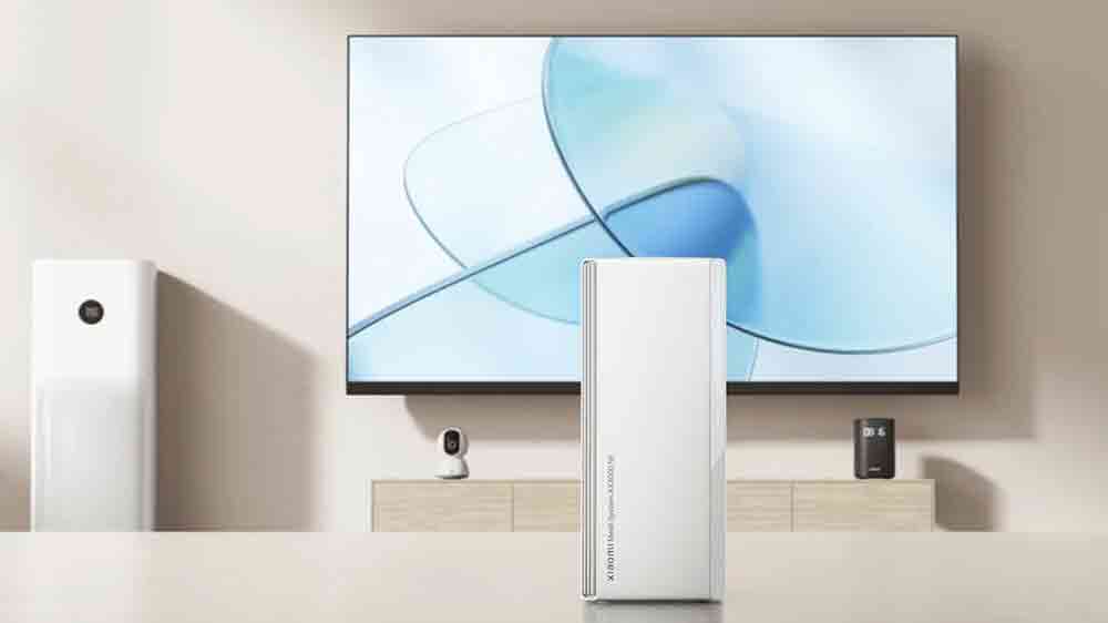 Mesh System Xiaomi AX3000 NE před televizí na stole_03