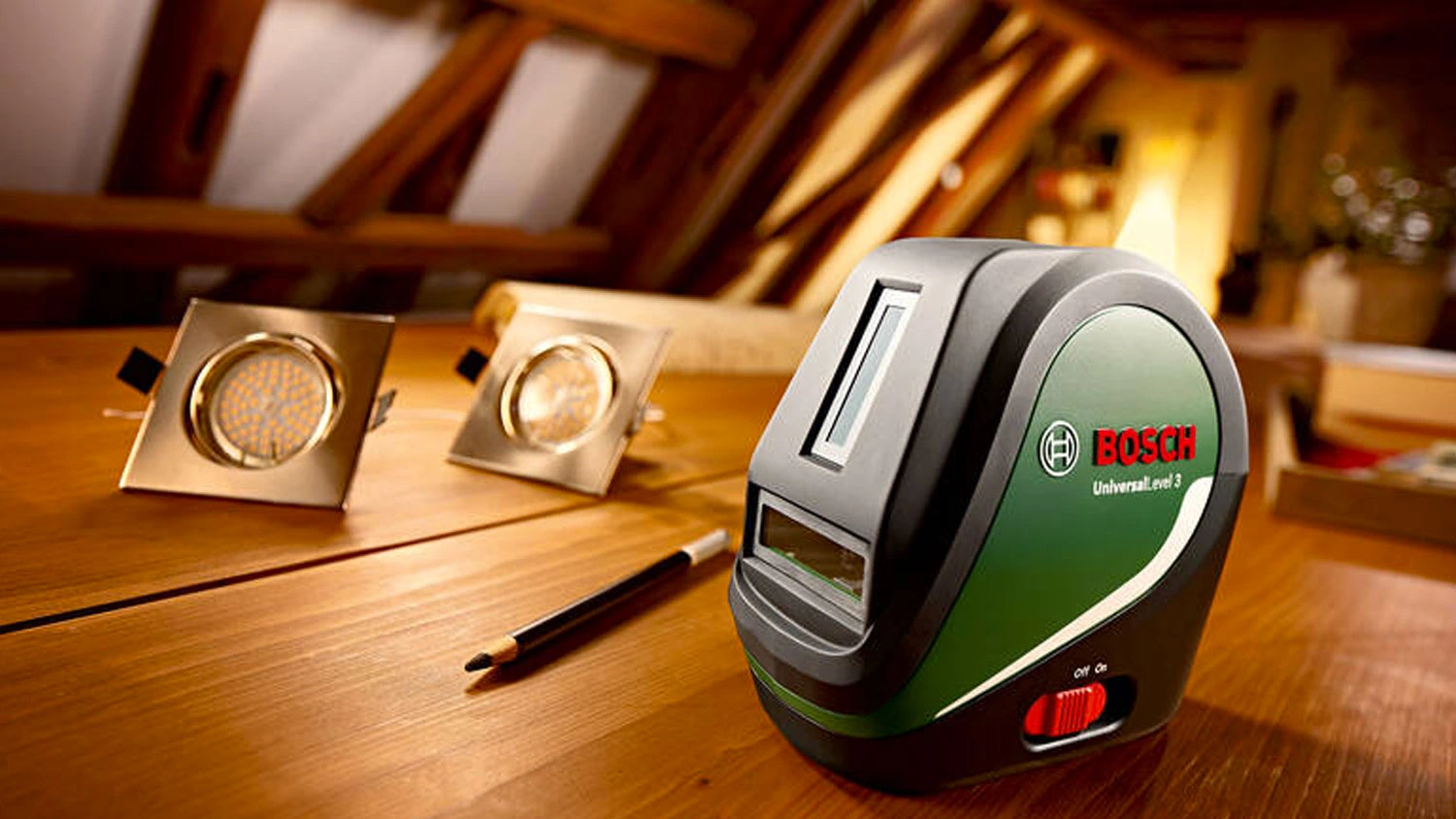 Kř&iacute;žov&yacute; laser Bosch UniversalLevel 3 na dřevěn&eacute; desce