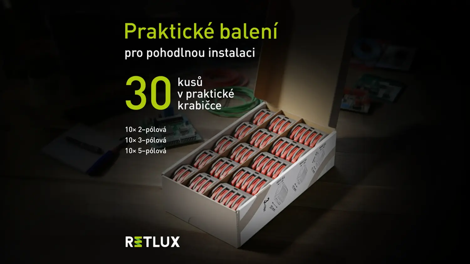 Otvorené balenie so súpravou 30 ks svoriek s páčkou Retlux RTB 101