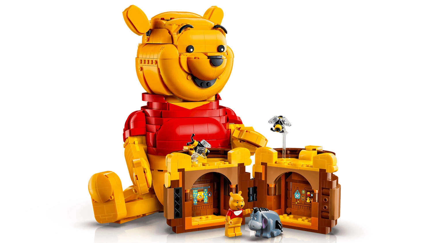 Model Medvídka Pú ze stavebnice LEGO® | Disney (43300), otevřená nádoba na med, sestavené včelky a minifigurky Medvídka Pú a Ijáčka
